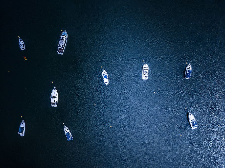 yachts on body of water during daytime, white-and-blue electronic devices lot HD wallpaper