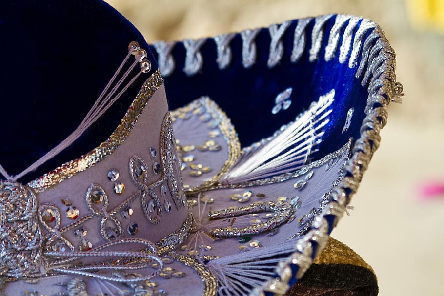 close-up photo of white and blue sequin hat, sombrero, mariachi
