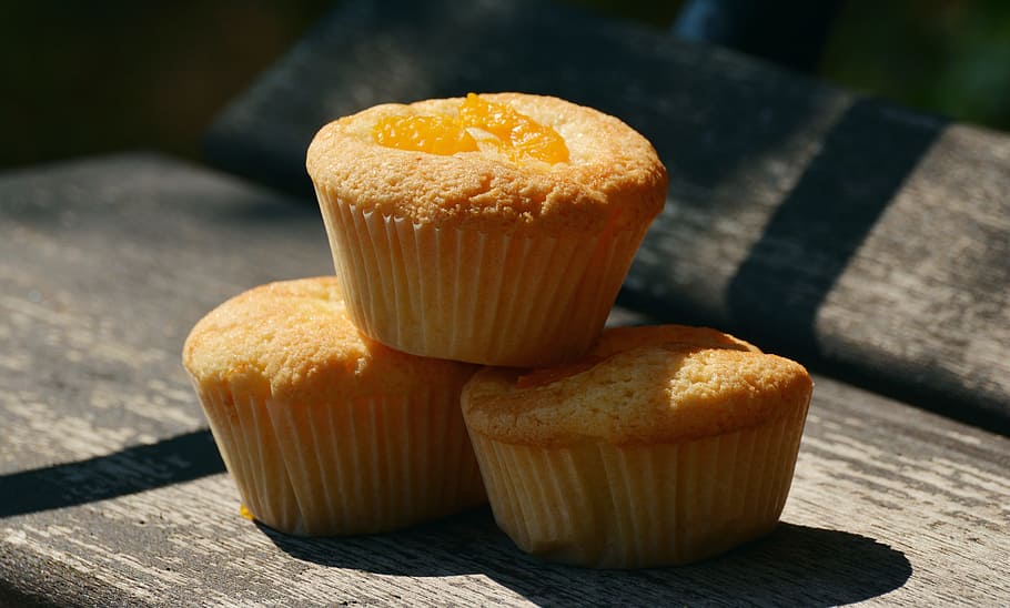 three muffins on brown surface, cupcakes, bake, small cakes HD wallpaper