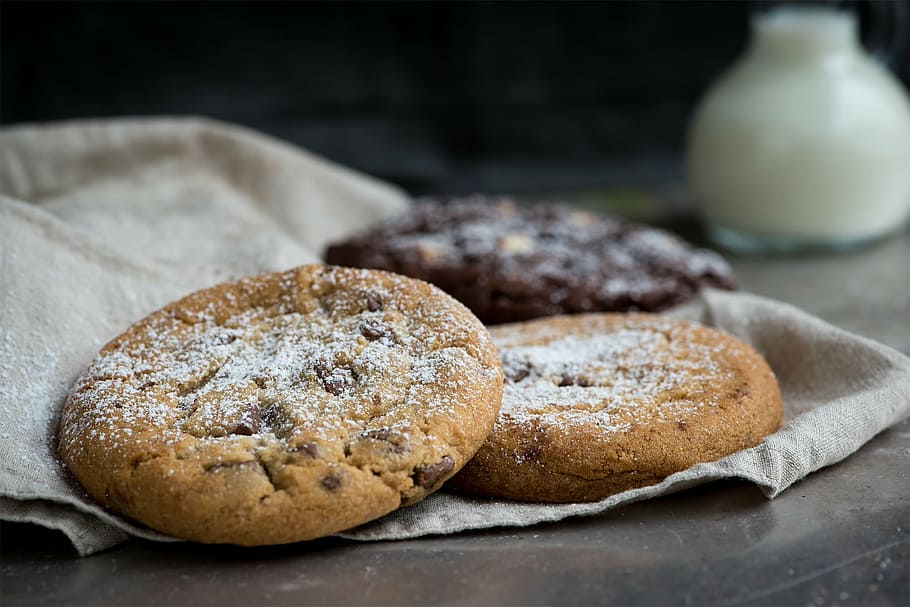 macro photography of two brown cookies, lighter cookie, nut cookie, HD wallpaper