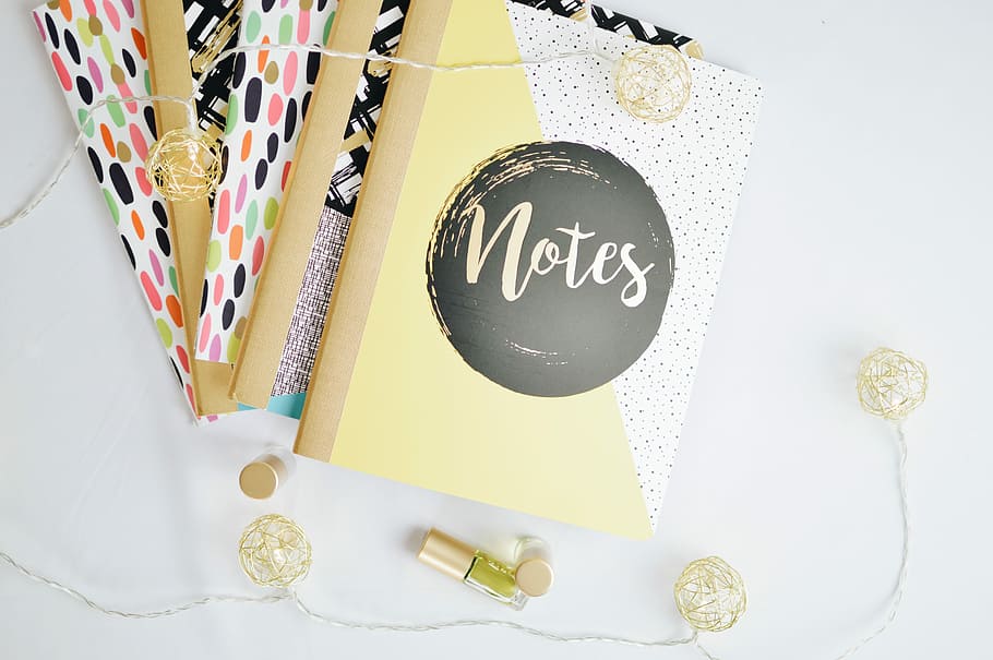 flat lay photography of string lights beside notebooks, Notes book beside a string light HD wallpaper