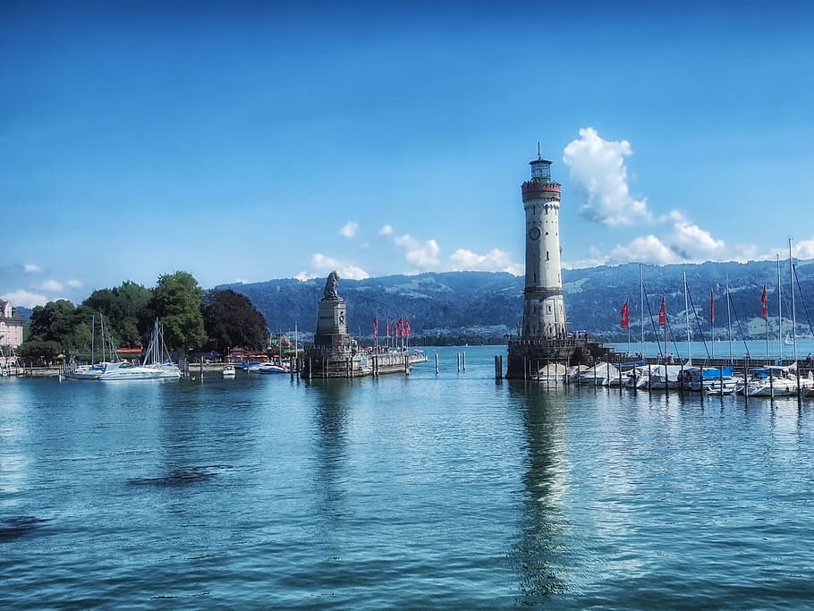 Lighthouse under blue sky, lindau, germany, harbor, mountains HD wallpaper