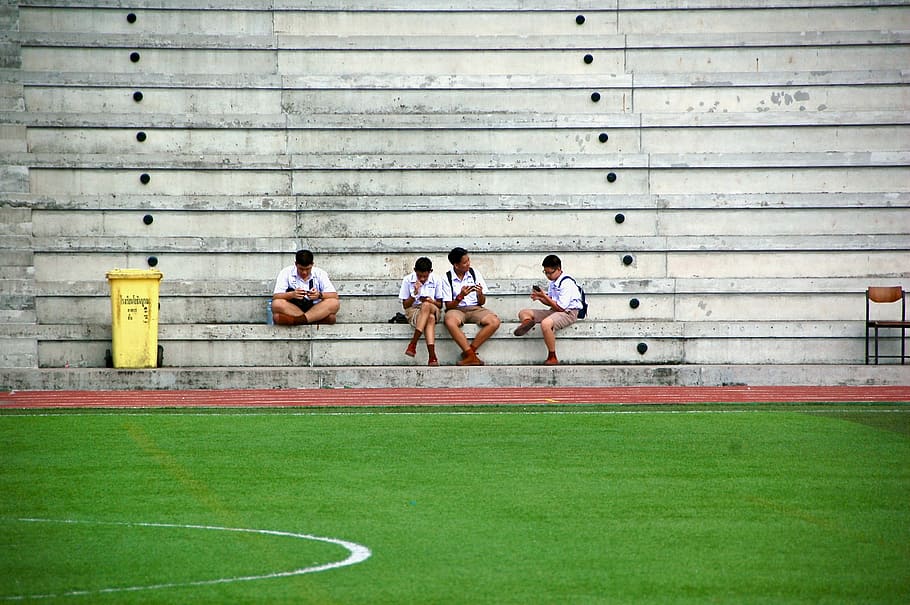 four boys wearing white shirt sitting near field, four mens sitting on chair in front of court HD wallpaper