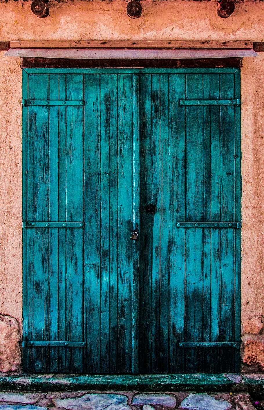 closed teal wooden door, colorful, storage, traditional, countryside