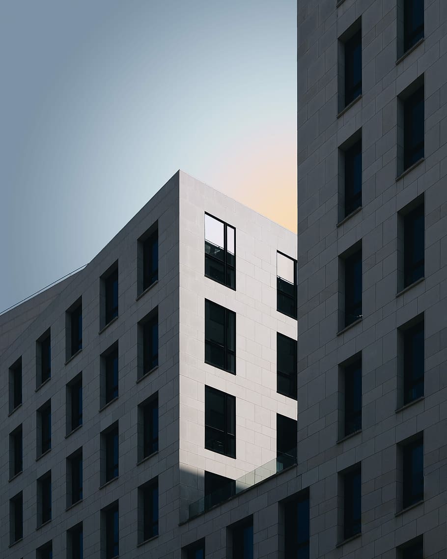 person taking photo of grey concrete building at daytime, photo of gray building HD wallpaper