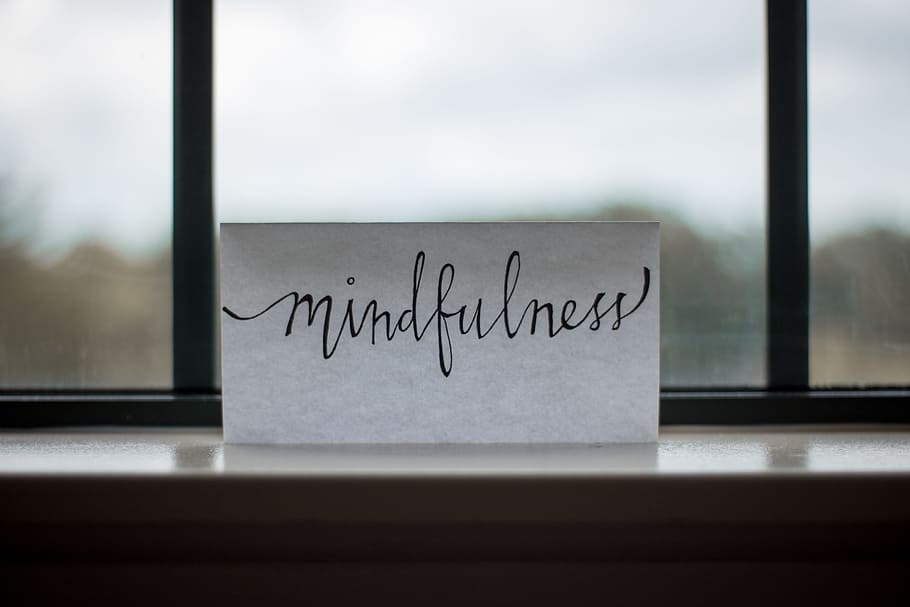 mindfulness printed paper near window, selective photo of Mindfulness printed paper on clear glass window HD wallpaper
