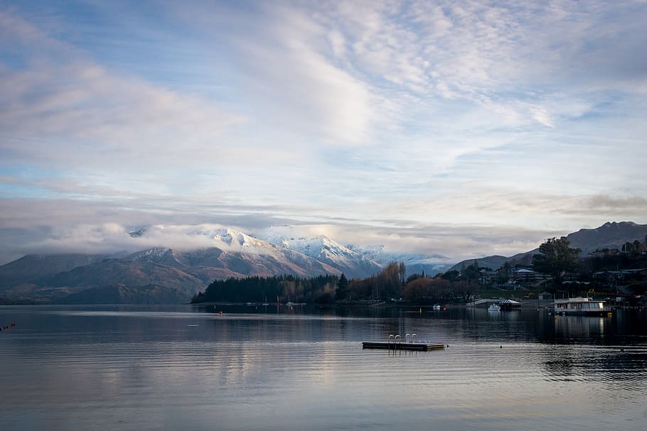 island on body of water near mountain under cloudy sky, body of water and boats HD wallpaper