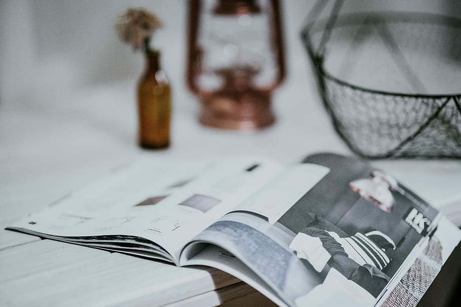 Magazine with a paraffin lamp on a white table, bottle, journal HD wallpaper