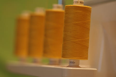 brown thread roll, spool, sewing, overlocker, cotton, polyester HD wallpaper