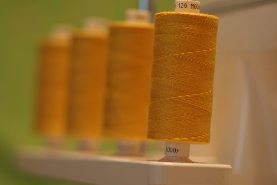 brown thread roll, spool, sewing, overlocker, cotton, polyester HD wallpaper
