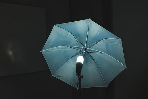 umbrella in front of switched on light, gray studio umbrella HD wallpaper