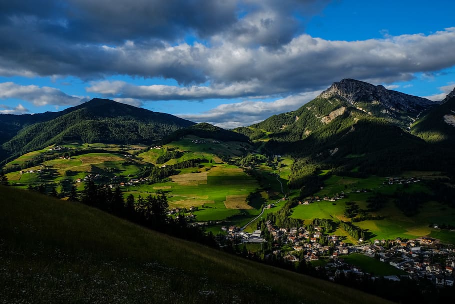 Aerial Photo of Two Mountains Distant from Group of Houses, clouds HD wallpaper