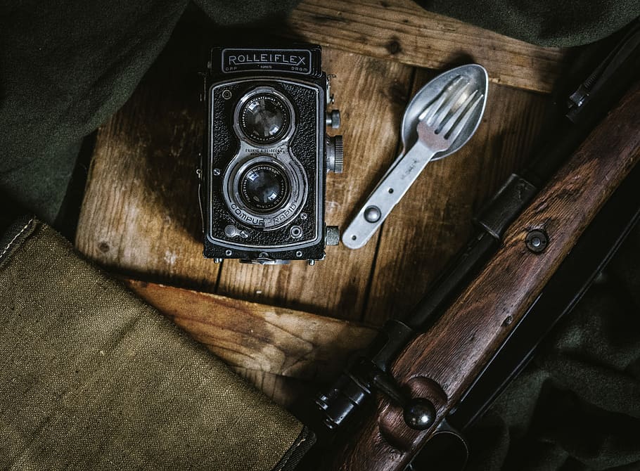 black land camera beside spoon and fork, flat lay photo of land camera beside utensil HD wallpaper