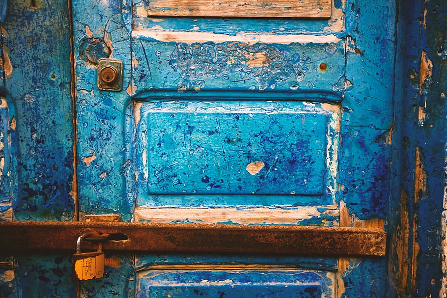 focus photography of blue wooden closed door, blue and brown wooden 4-panel door