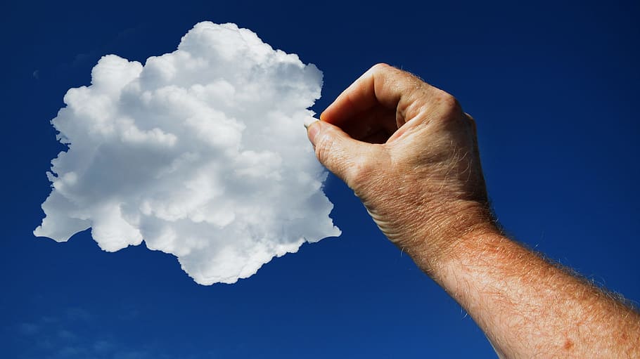 low angle photo of pointing right human arm towards white cloud on blue sky during daytime HD wallpaper