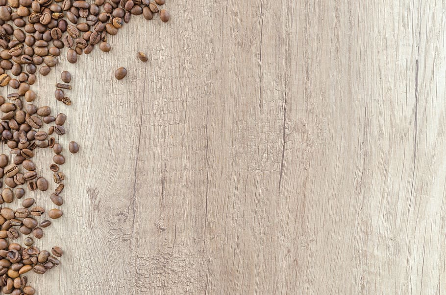 roasted brown coffee beans scattered on brown wooden surface, HD wallpaper