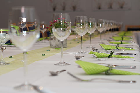 selective focus photography of wine glasses and forks with table napkins HD wallpaper