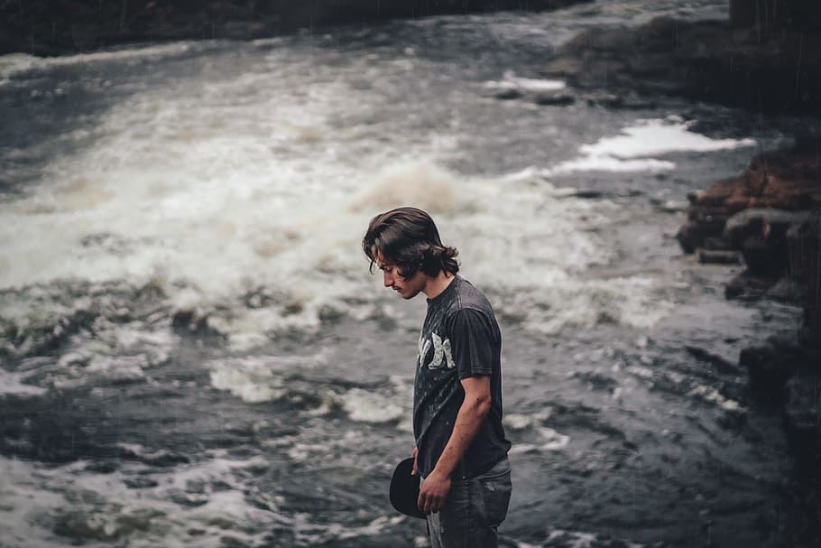 person standing near body of water, man standing near rushing river at daytime HD wallpaper