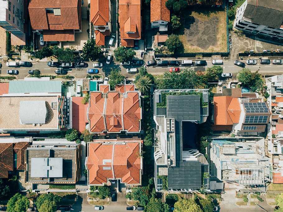 aerial photo of orange and grey concrete building, aerial photography of brown and black buildings at daytime HD wallpaper