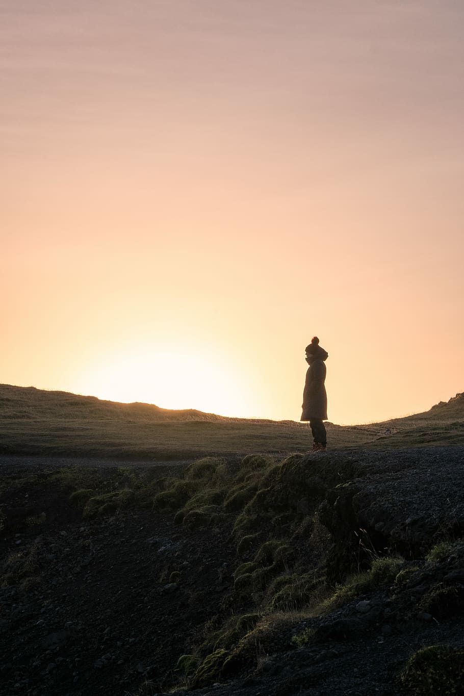 silhouette of person standing on hill during golden hour, person standing on mountain during golden hour HD wallpaper