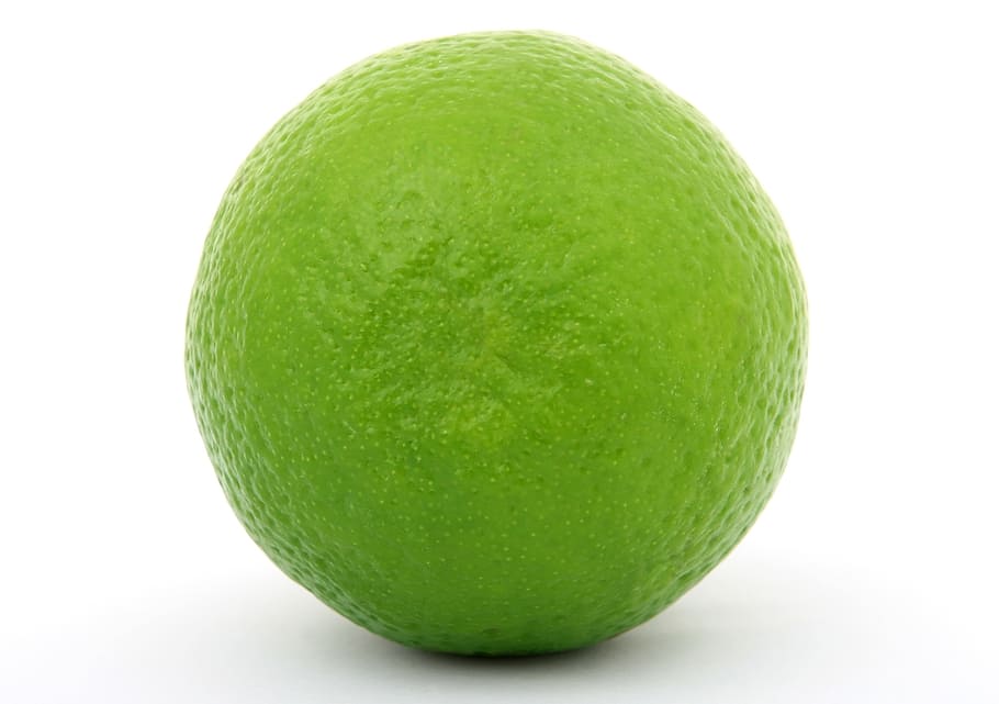 selective focus photography of green lime on white surface HD wallpaper