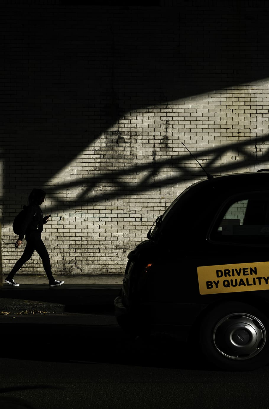 person walking towards black vehicle, wall, brick, shadow, sunlight HD wallpaper