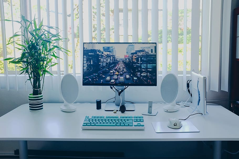 black flat screen computer monitor; keyboard; speakers; mouse on desk, photo of turned-on flat screen TV, HD wallpaper