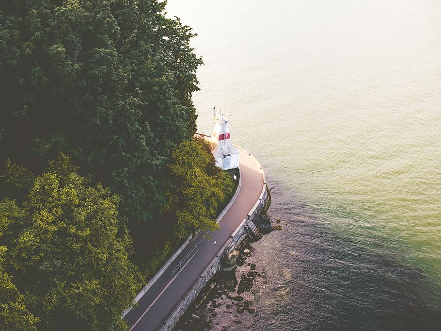 Last Sun on a Lighthouse, road beside body of water during daytime HD wallpaper