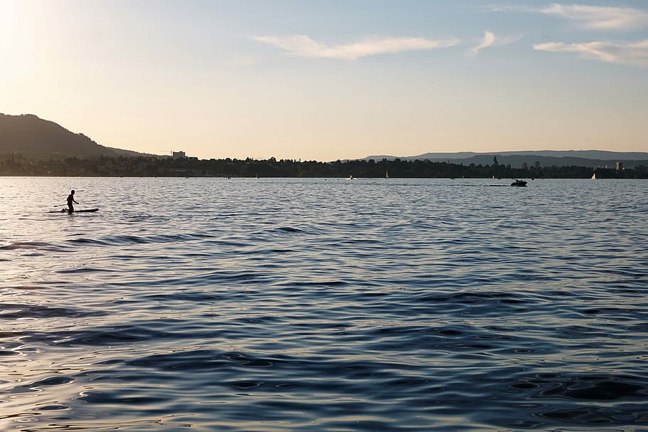 silhouette of surfer on ocean during daytime, lake constance HD wallpaper