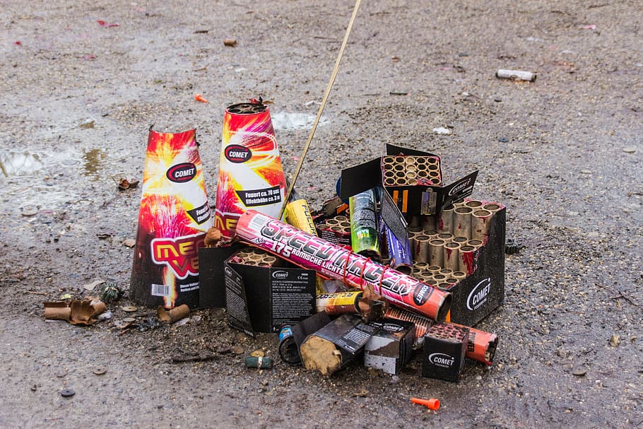 assorted fireworks boxes on gray pavement at daytime, pyrotechnics HD wallpaper