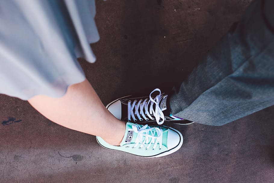 close up photo of man and woman in teal and black Converse All Star low top sneakers, HD wallpaper