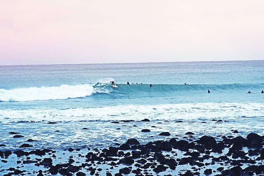 people surfboarding during daytime, person surfing on wave of water HD wallpaper