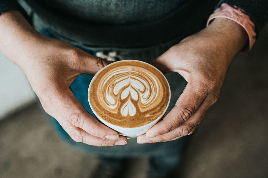 person holding mug filled with cafe latte, coffee, hot, drink HD wallpaper