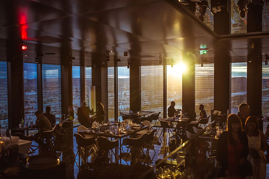 people gathering inside cafe during golden hour, people sitting near chair inside store during daytime, HD wallpaper