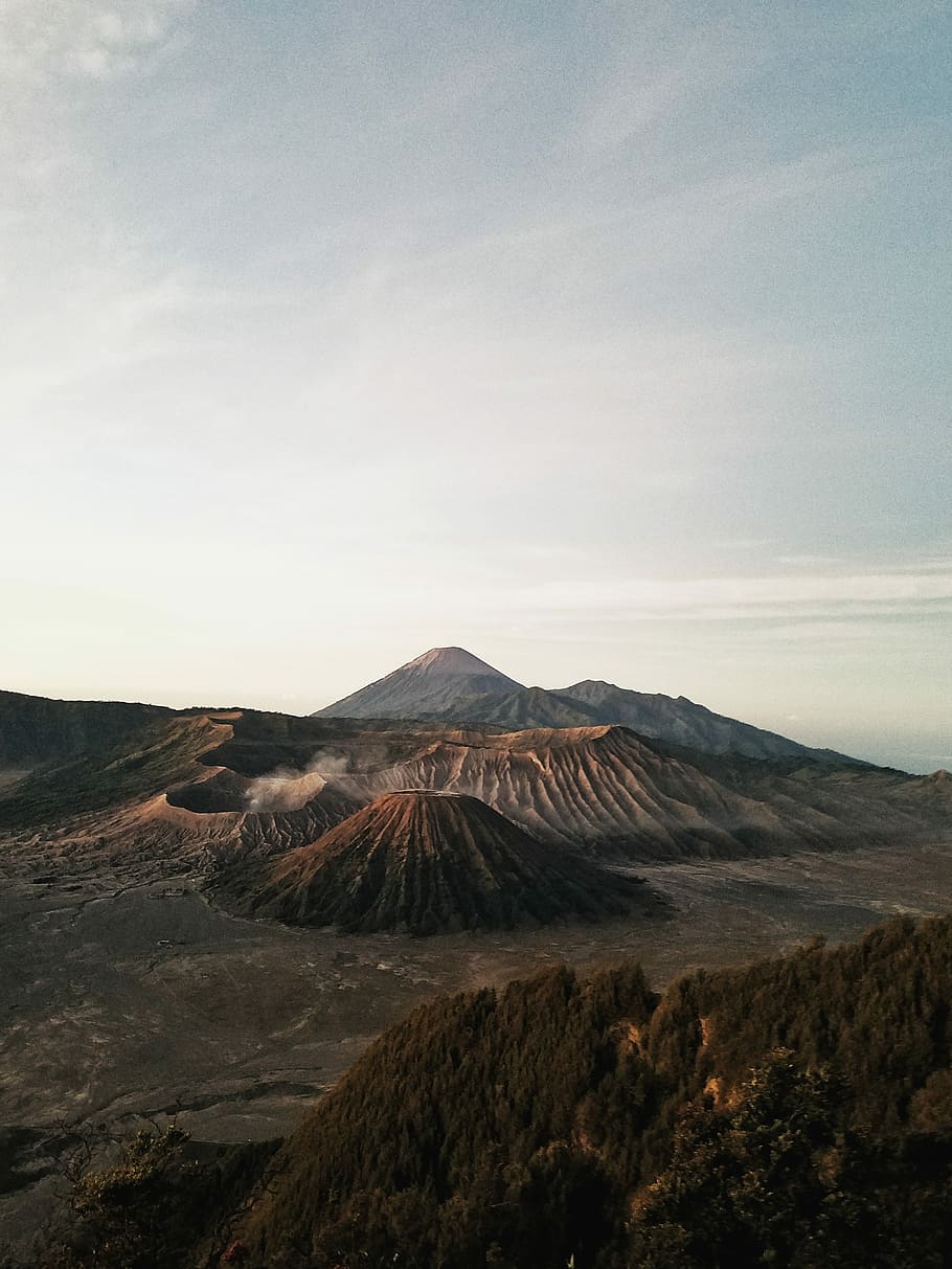 photo of crater and mountain, brown rock mountain during daytime HD wallpaper