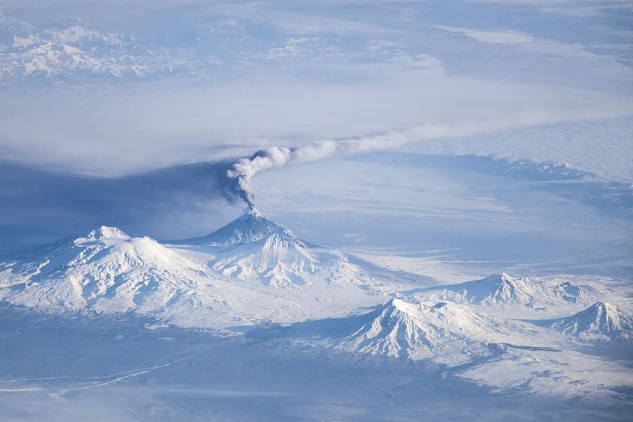 snow covered mountains under sunny sky, kliuchevskoi volcano