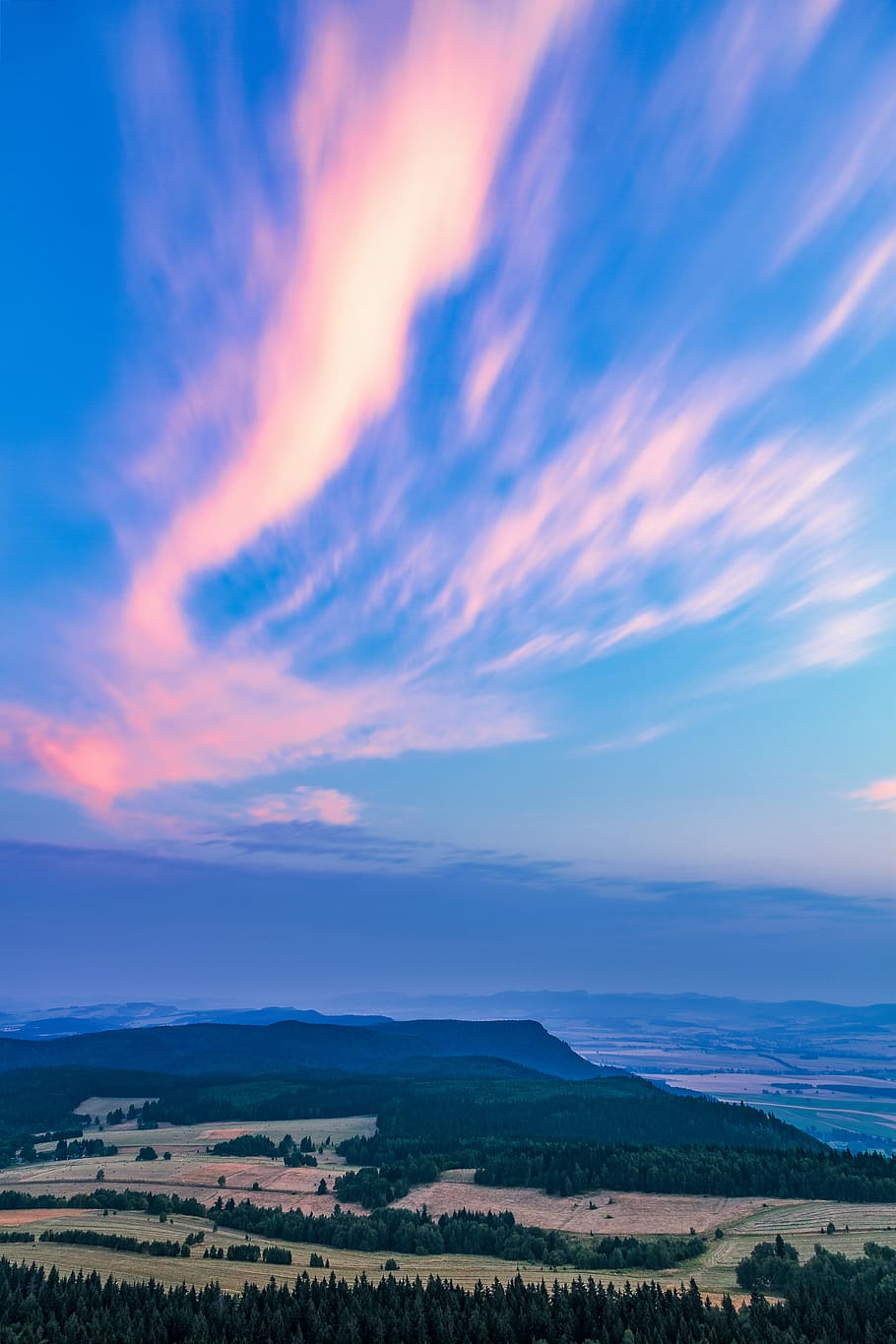 clouds on mountain, aerial photo of trees and hills below blue skies HD wallpaper