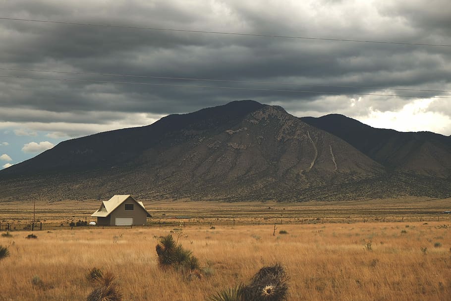 wooden house near mountain ranges, mountain under the cloudy sky HD wallpaper