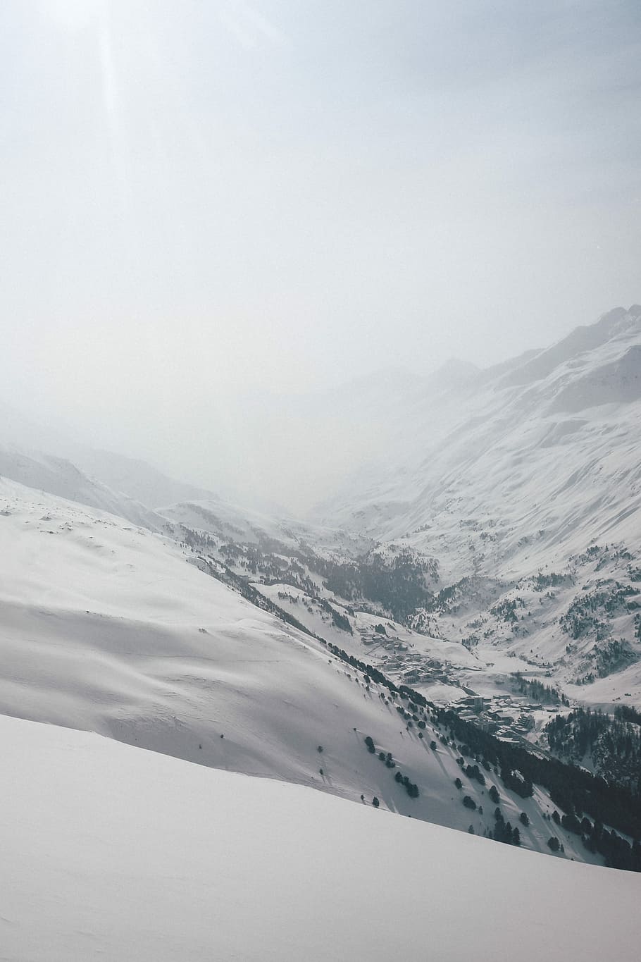 snowy mountain under sun light, aerial photography of hills with snow HD wallpaper