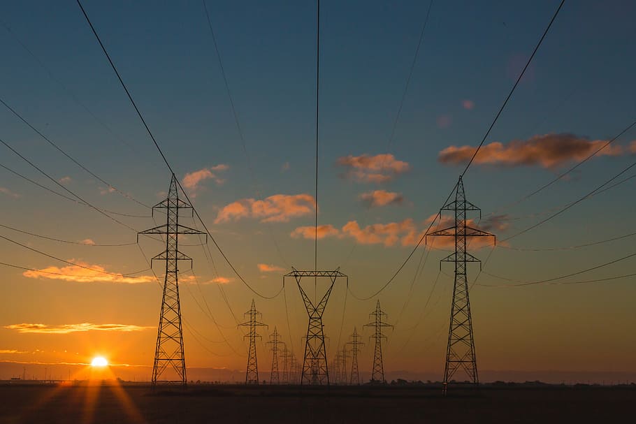 several transmission towers under blue sky, dawn, dusk, electricity