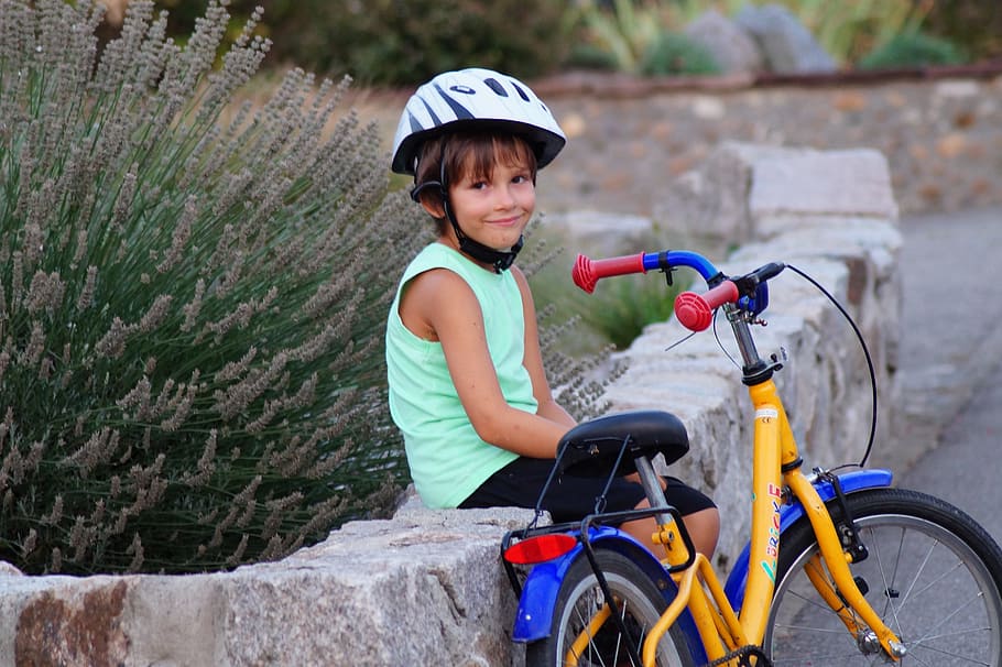 boy sitting on concrete rails beside bicycle, round, helmet HD wallpaper