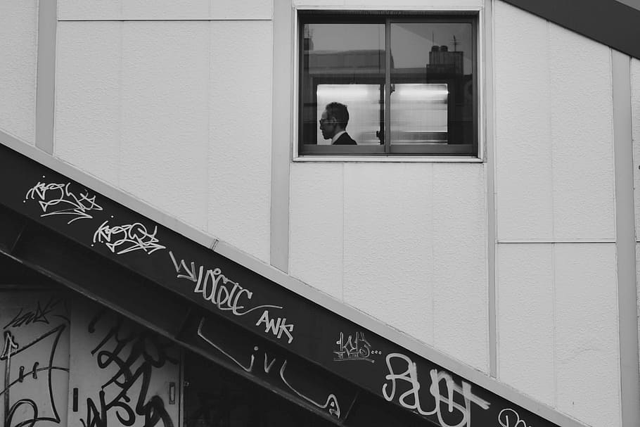 grayscale photography of window, grayscale photo of man sitting beside window inside building HD wallpaper