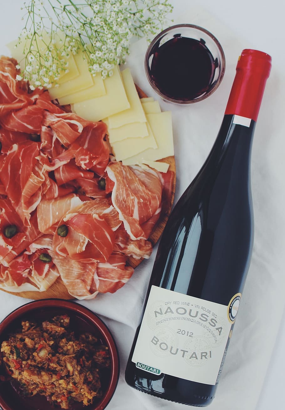 photo of Naoussa Boutari bottle beside bowl and raw meat, aperitif HD wallpaper