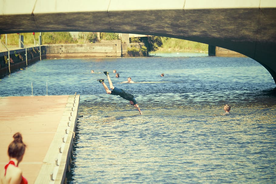 person diving in body of water, daytime, swimming, dive, bridge HD wallpaper