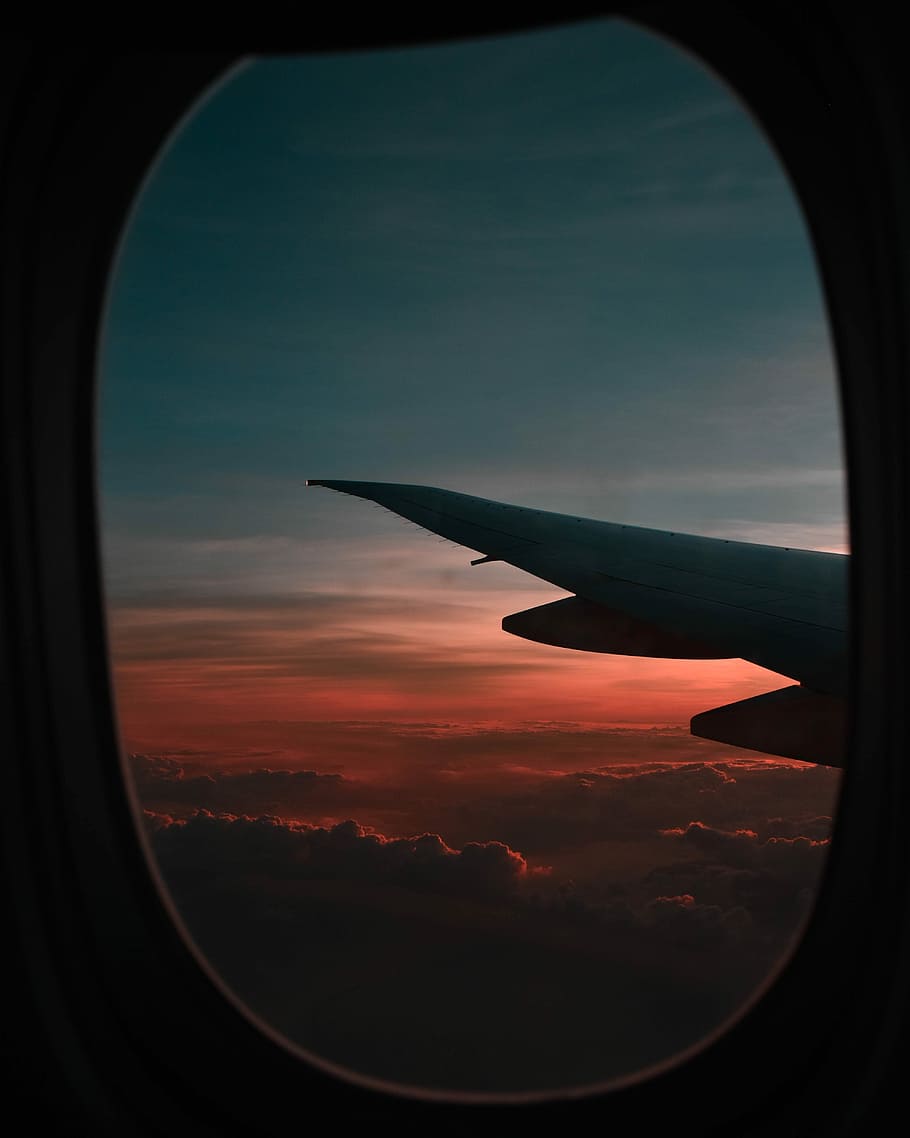 window view of airplane during golden hour, photo of clouds taken inside plane near its wing HD wallpaper