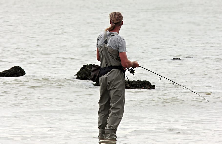 man holding fishing rod, angler, north sea, waters, fischer, beach