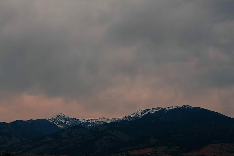 silhouete of mountains, black and white mountain under gray cloudy sky at daytime HD wallpaper