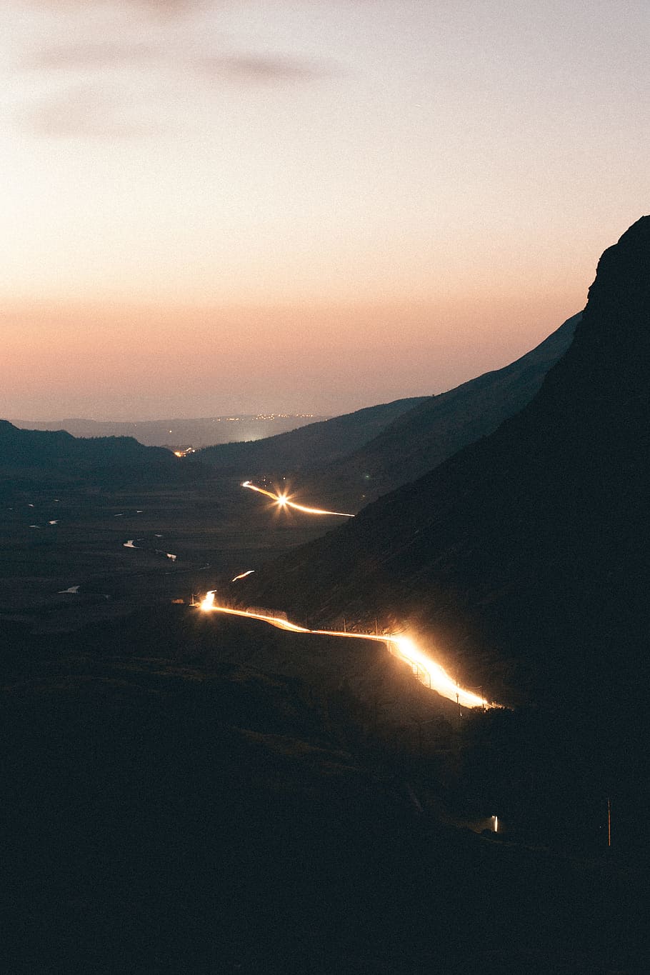 bright road on mountain, bird's-eye view photography of road near hills HD wallpaper