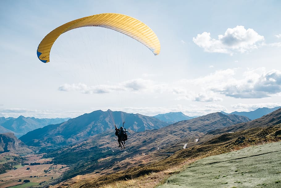 person on parachute, person on yellow parachute flying during daytime HD wallpaper