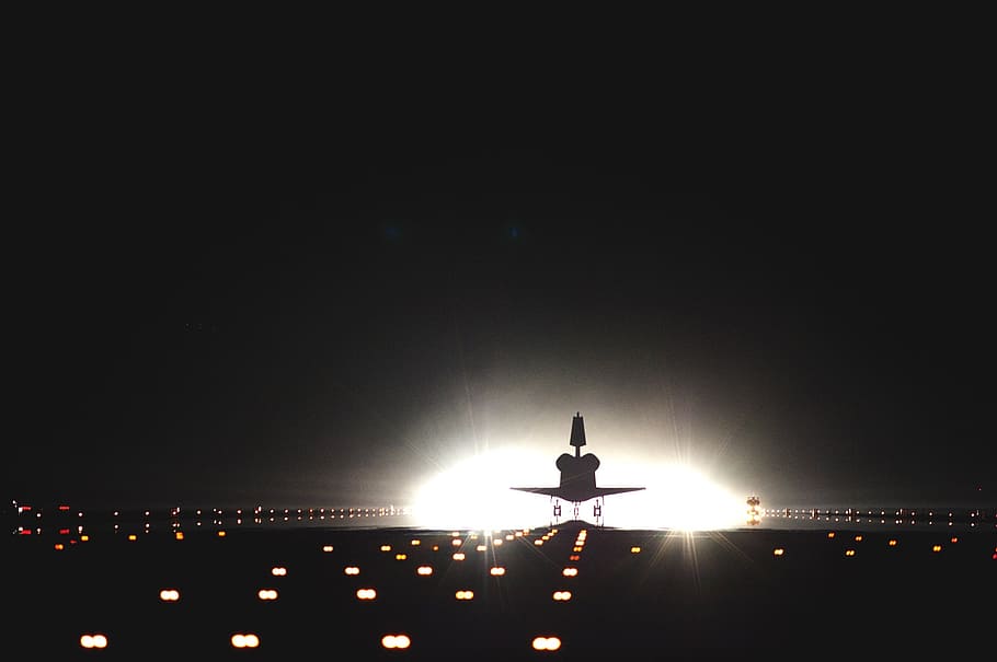 plane on runway road during night, space shuttle, atlantis, landing
